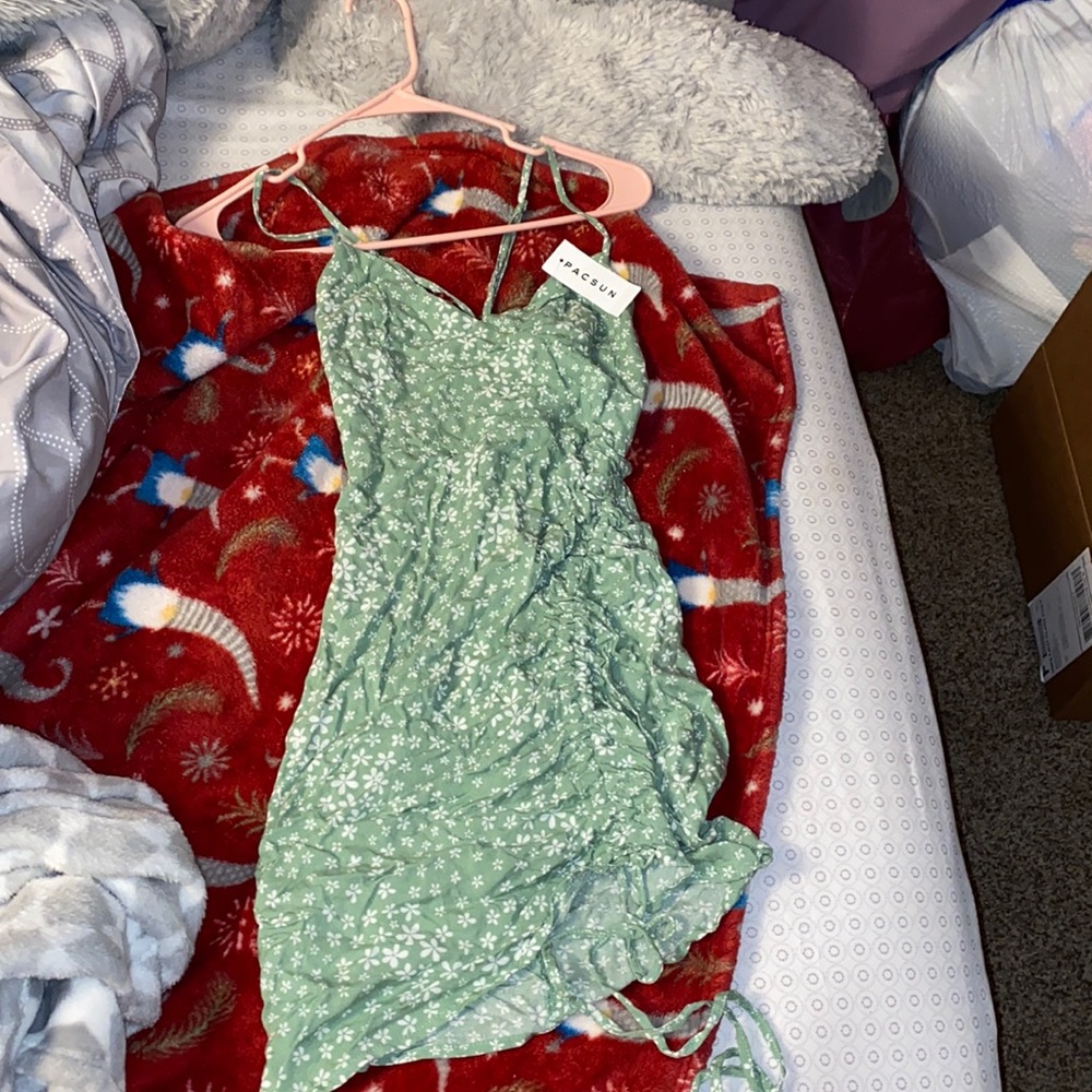 Light green with white flowers , strappy dress . It is a size xs